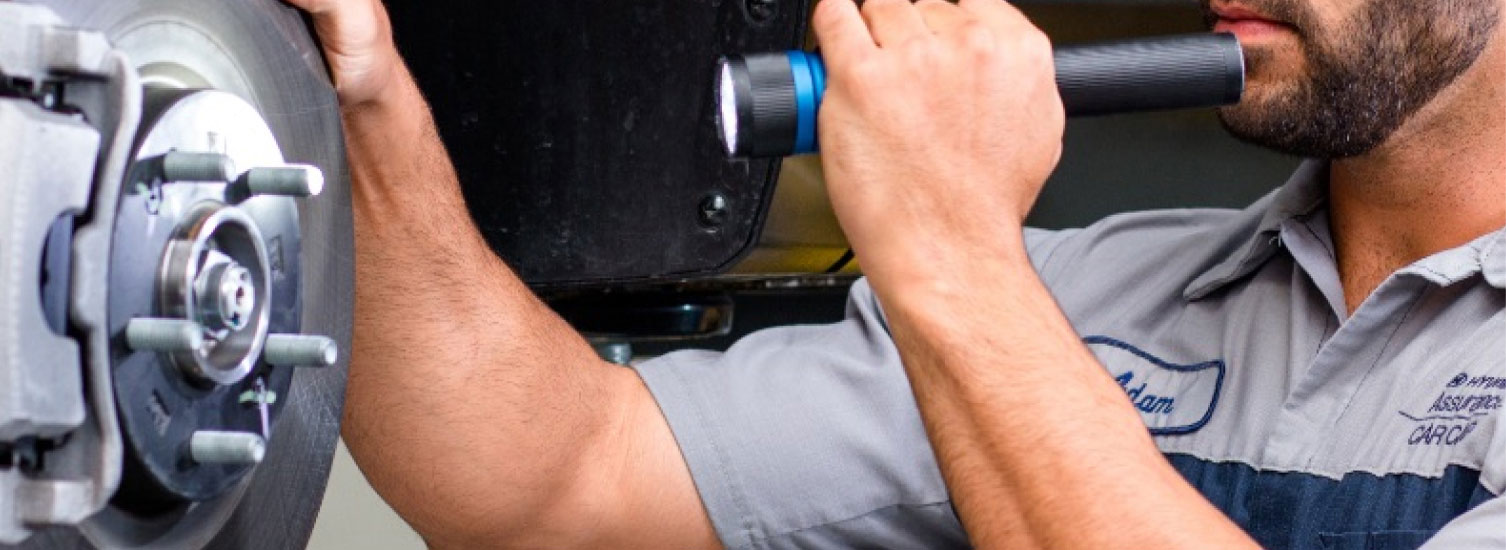 Hyundai mechanic servicing brakes