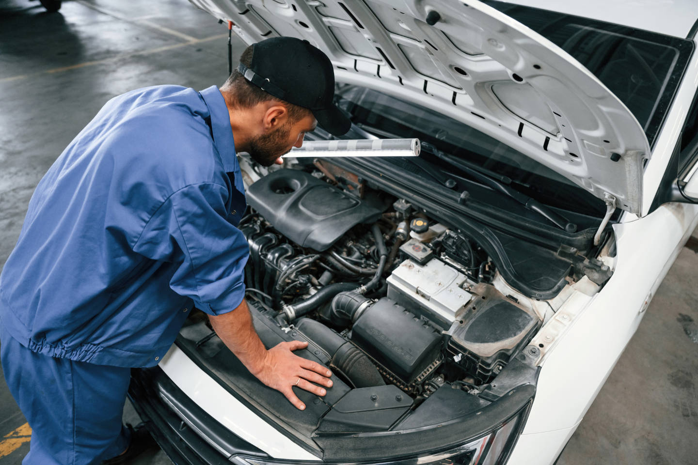 mechanic working on an engine