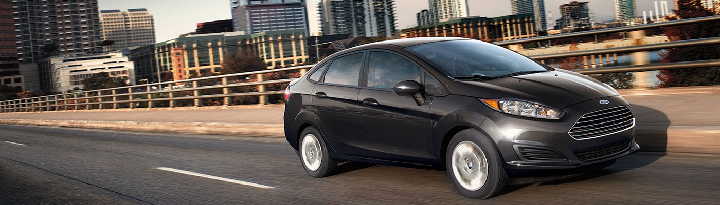 Black 2019 Ford Fiesta Black 2019 Ford Fiesta driving on highway