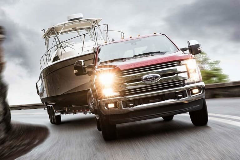 2019 F-250 towing Red 2019 F-250 towing a white boat