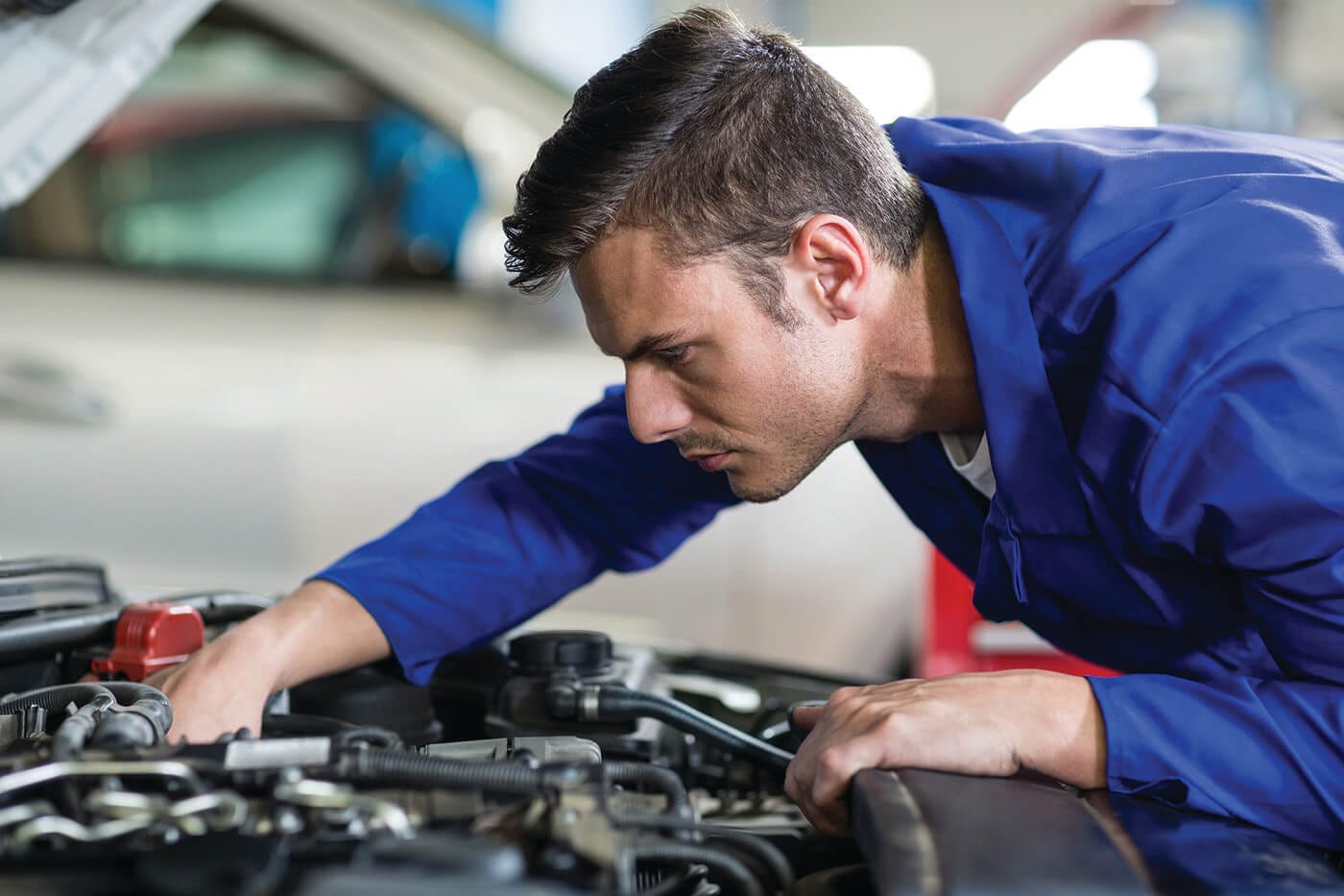 man fixing engine at Greenbrier Ford in Lewisburg, WV