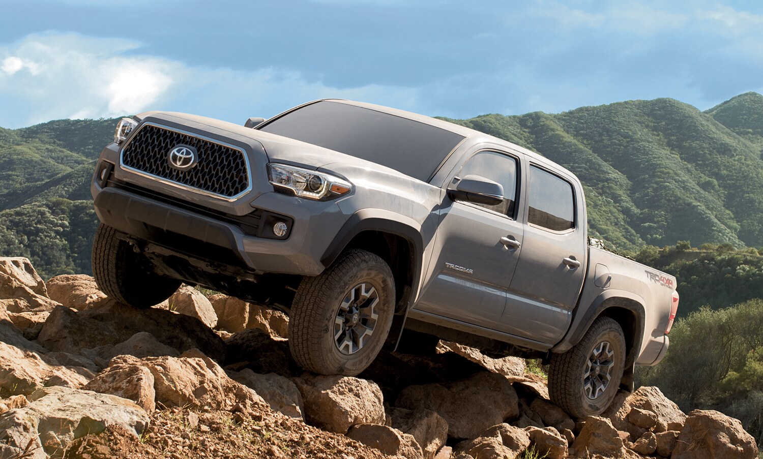 TacomaOffRoading.jpg Tacoma off-roading on a rocky hillside