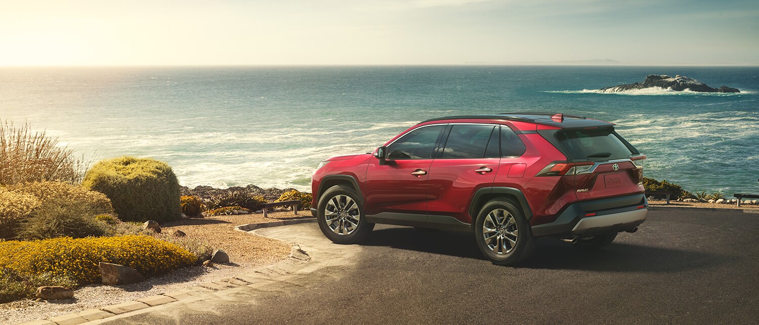 RAV_Footer.jpg red RAV4 driving away