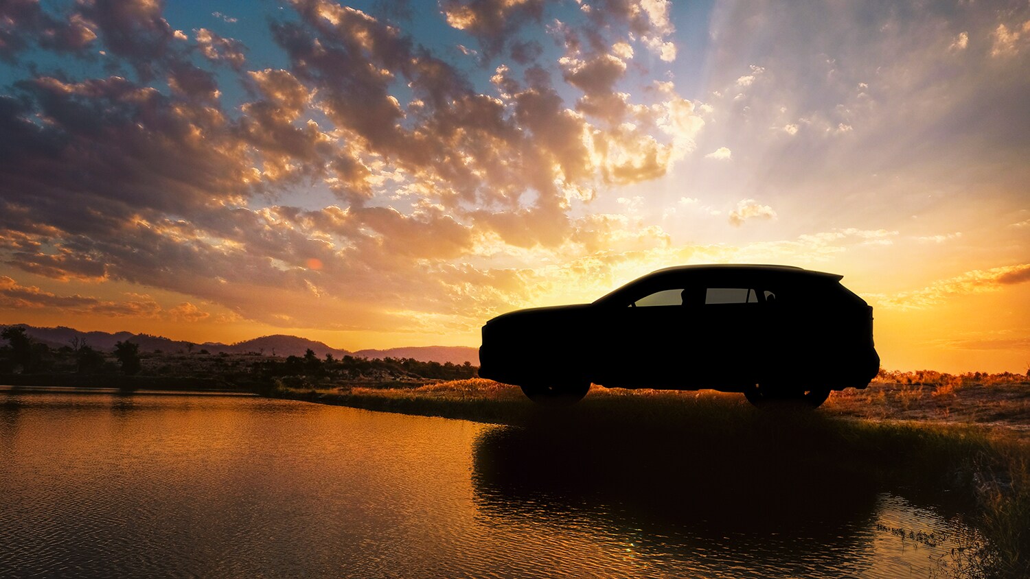 Sunset.jpg Silhouette view of the 2019 Rav4 at sunset
