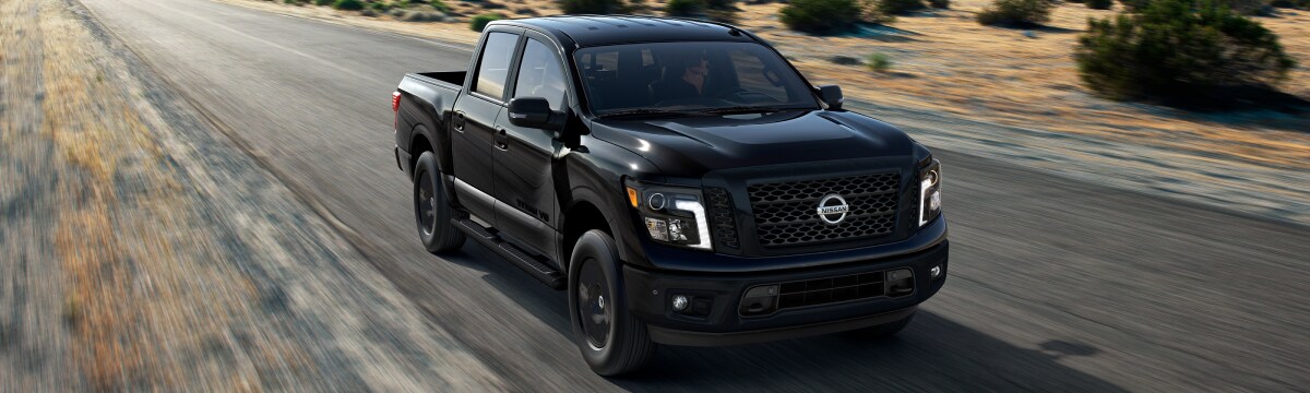 2019-Nissan-Titan-SV-MidnightEdition-CrewCab-Truck-L01 (1).jpg New Nissan Titan Midnight Edition on a country road
