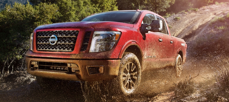 Nissan Titan Pro Nissan Titan Pro driving through the mud