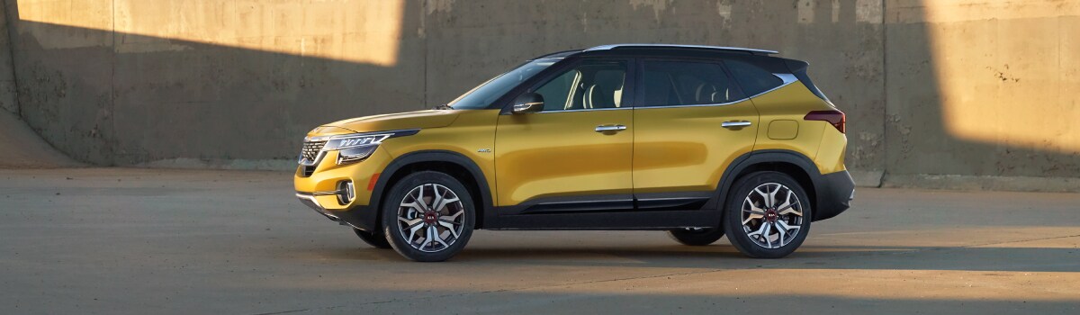 2021-KIA-Seltos-SX-SUV-L11 (1).jpg New Kia Seltos outside next to a stone wall