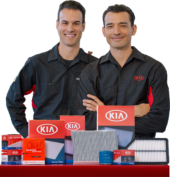 Two mechanics in front of parts.