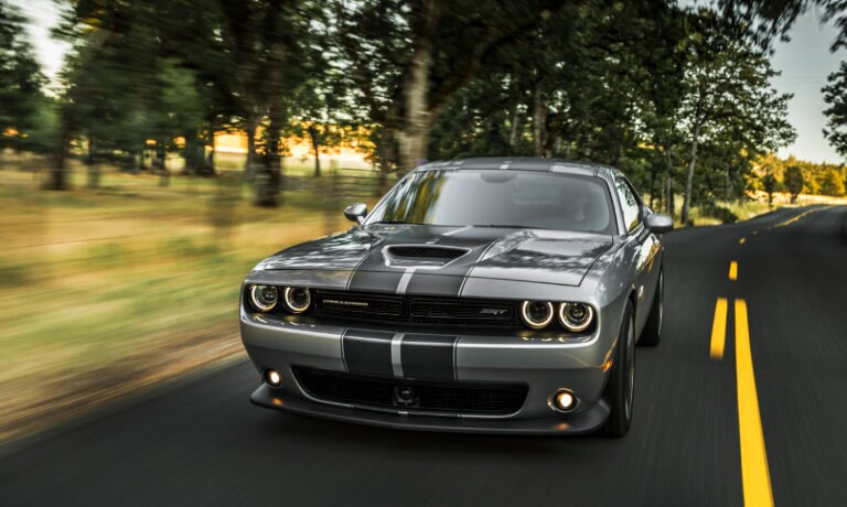 Dodge Challenger driving past the country side