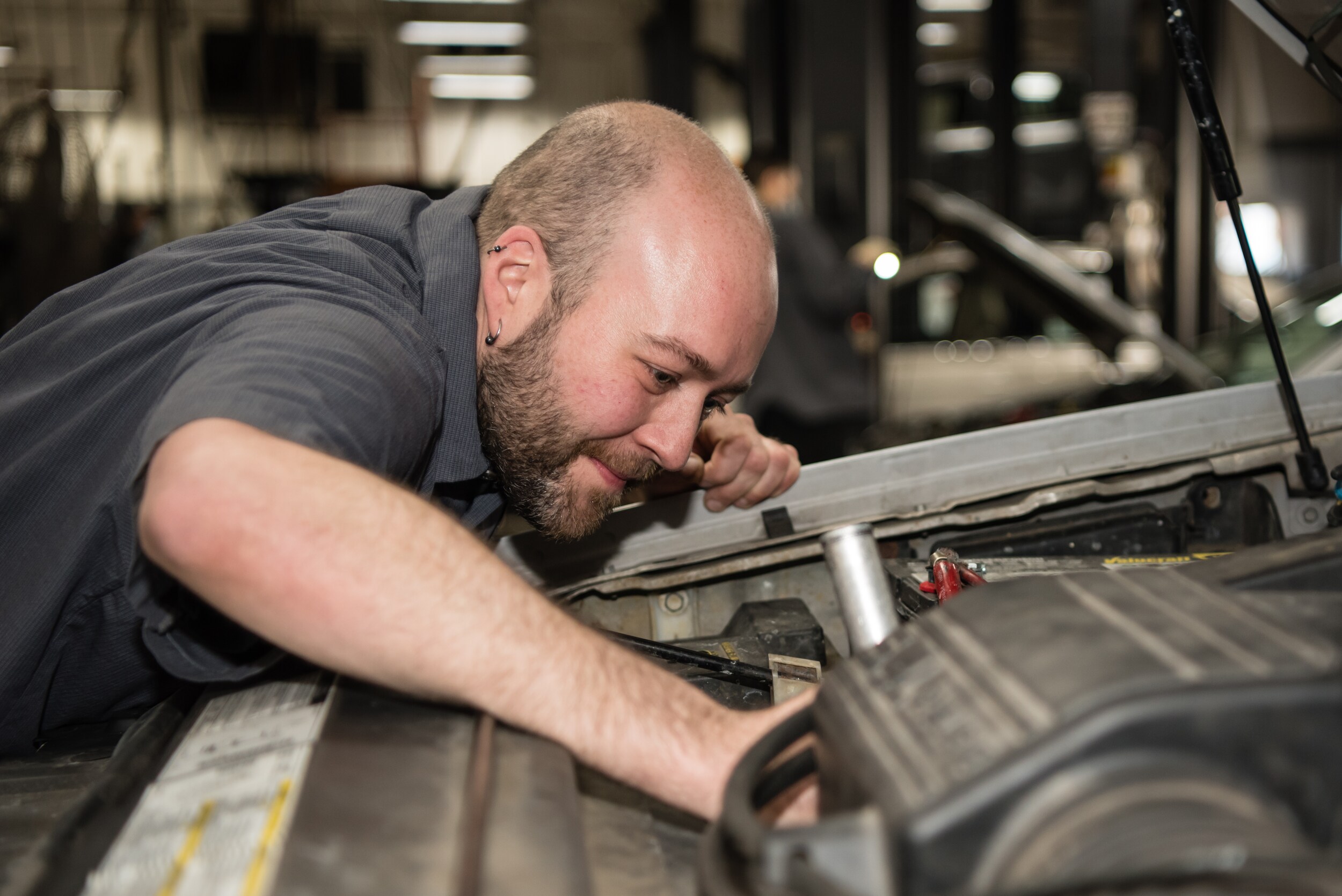 Josh Gibson working on vehicle.jpg