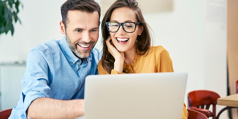 Couple using laptop to shop
