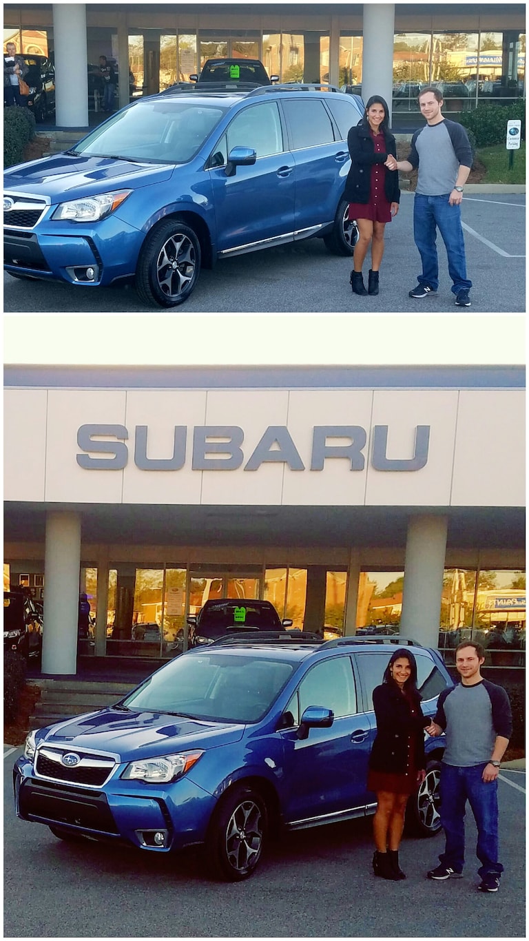 Francis Leake shakes his saleswoman, Leidy Rhines' hand after he purchases his first Subaru - a 2015 Forester.jpg