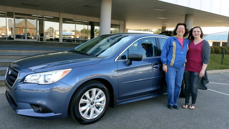 Donna Holt with Sales Advisor Brittany Cook in front of her new 2017 Subaru Legacy.jpeg