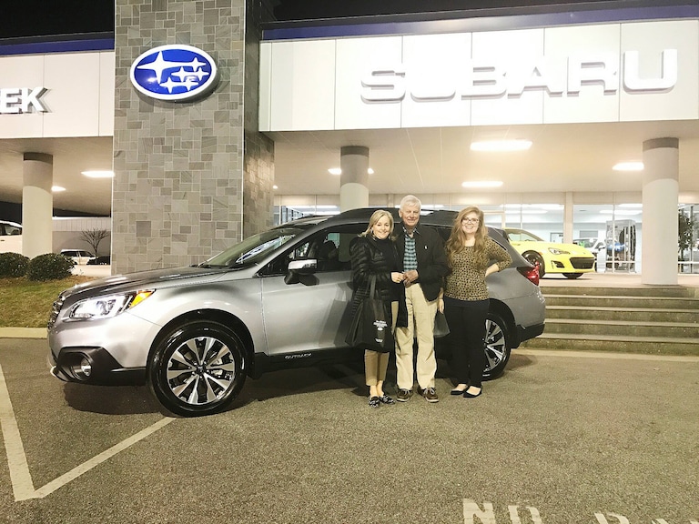 Vicky & Jim with Sr Sales Advisor Emily & their new 2017 Outback.jpg