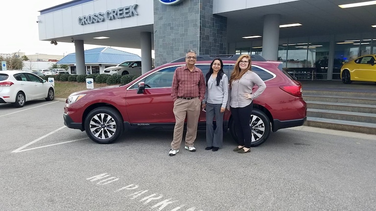 The Patels with Sr Sales Advisor Emily Bracey and their 2nd Subaru - a 2017 Outback.jpg