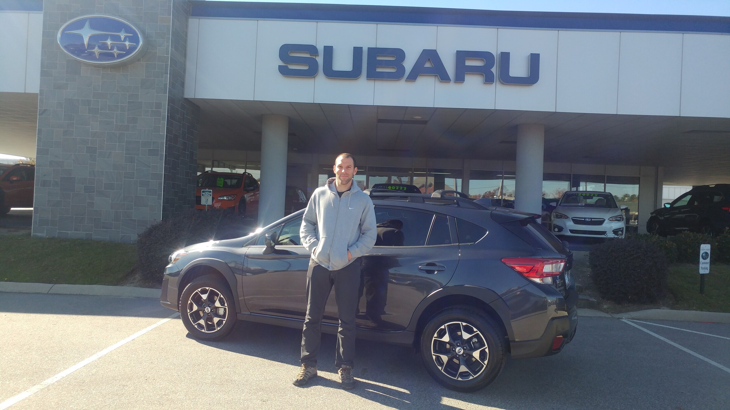 Timothy with his new 2018 Crosstrek.jpg
