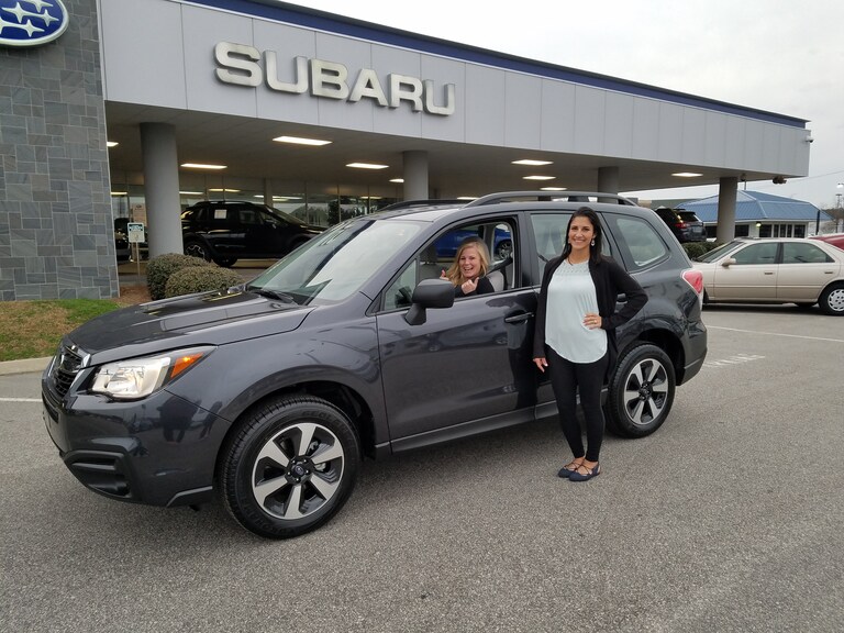 Norry with Sales Advisor Leidy and hernew 2017 Forester.jpg