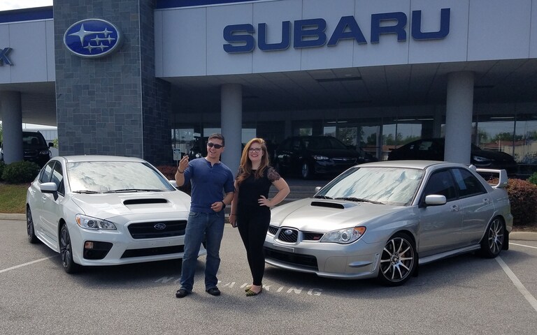 Adam with Sr Sales Advisor Emily trading in the keys to his older STI for a new 2017 WRX.jpg