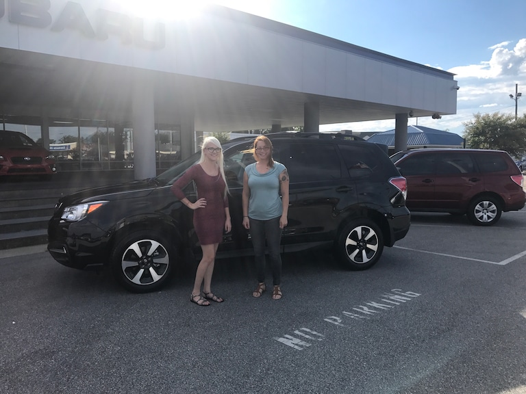 Jessica with Sales Advisor Ava in front of her new 2017 Forester.jpg