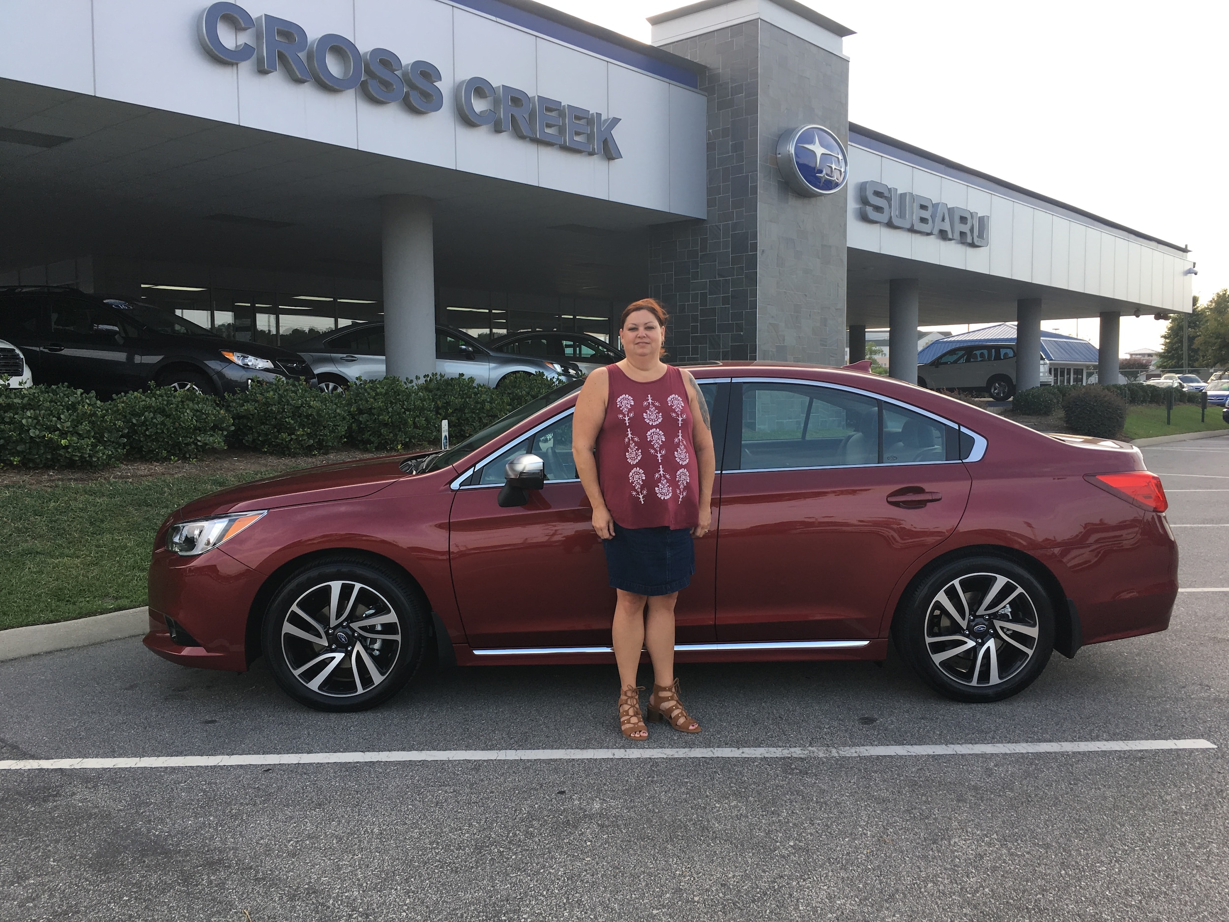 Michelle with her first Subaru - a 2017 Legacy.JPG