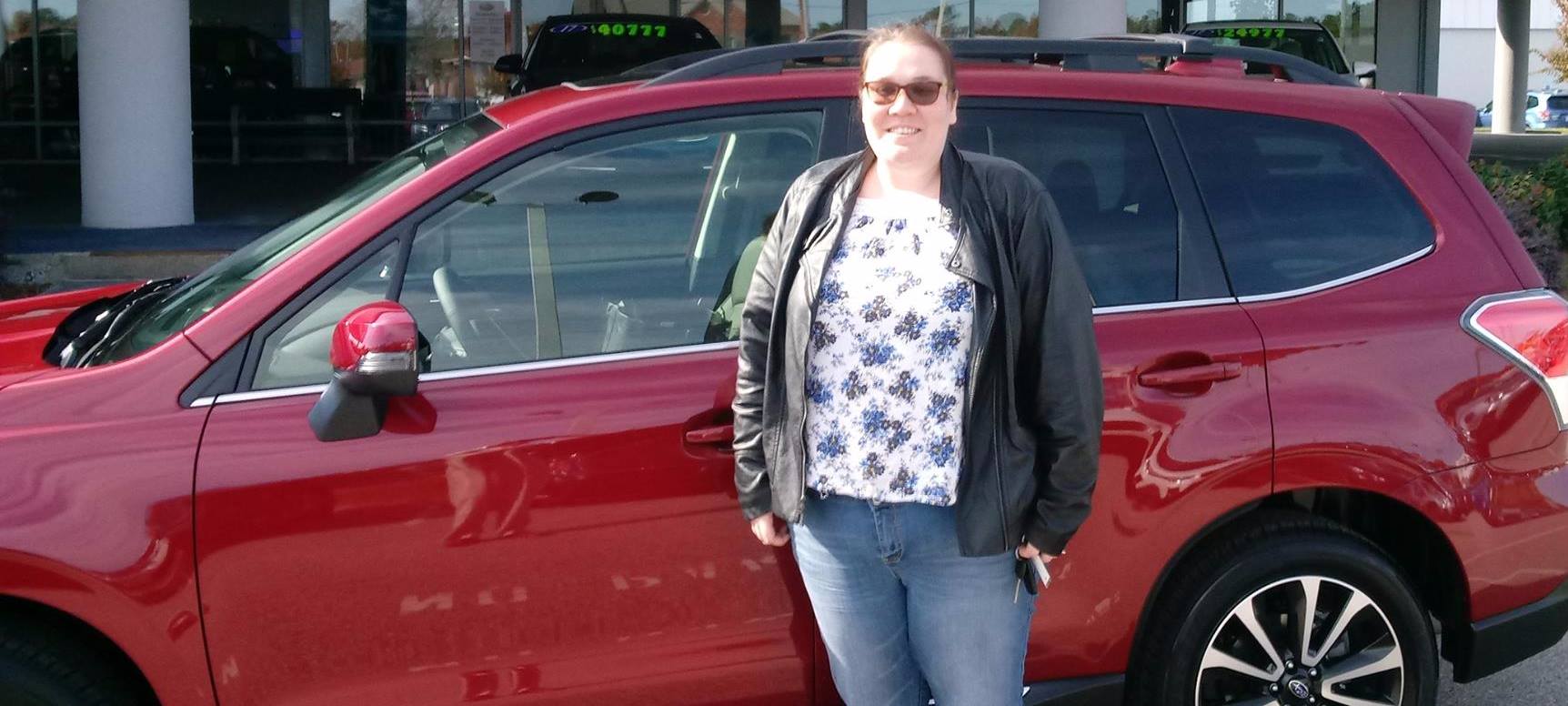 Jessica with her new 2018 Forester.jpg