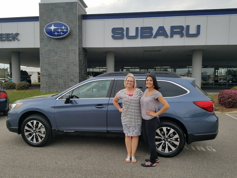 Carrie Podobinski in front of her new 2017 Outback 3.6R Limited with Sales Advisor Leidy.jpg