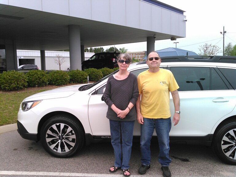 The Pilands with their first Subaru - a 2017 Outback.jpg