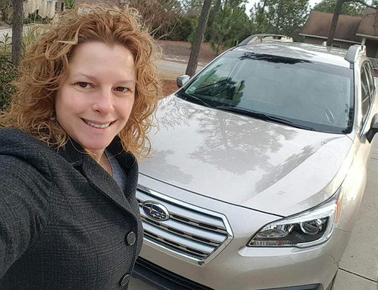Sandra Salinero with her first Subaru - a 2017 Outback!.jpg
