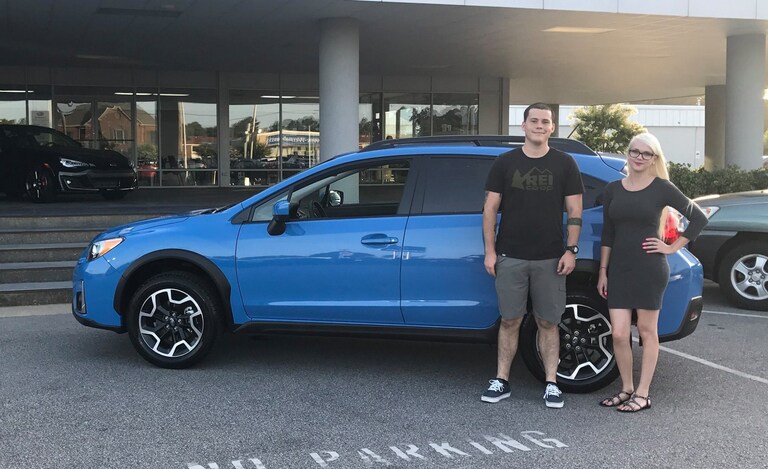 Ryan with Sales Advisor Ava in front of his new Subaru Crosstrek.jpg