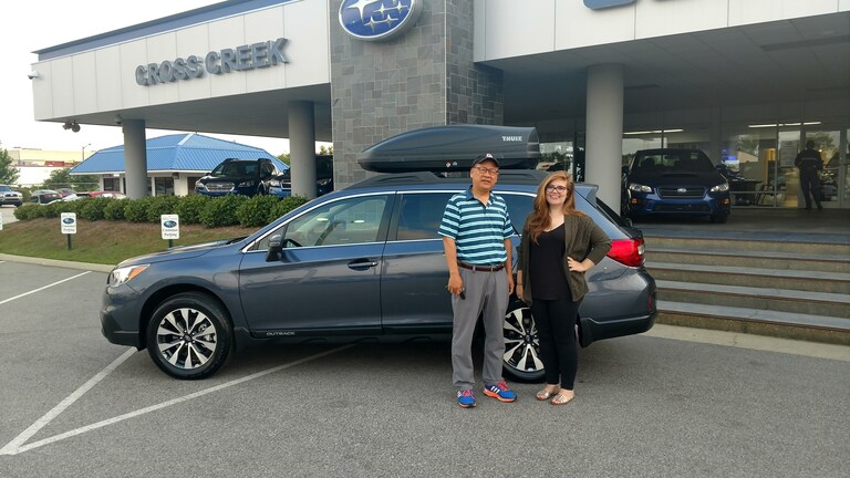 Yong with Sr Sales Advisor Emily in front of he and his wife's new 2017 Outback!.jpg