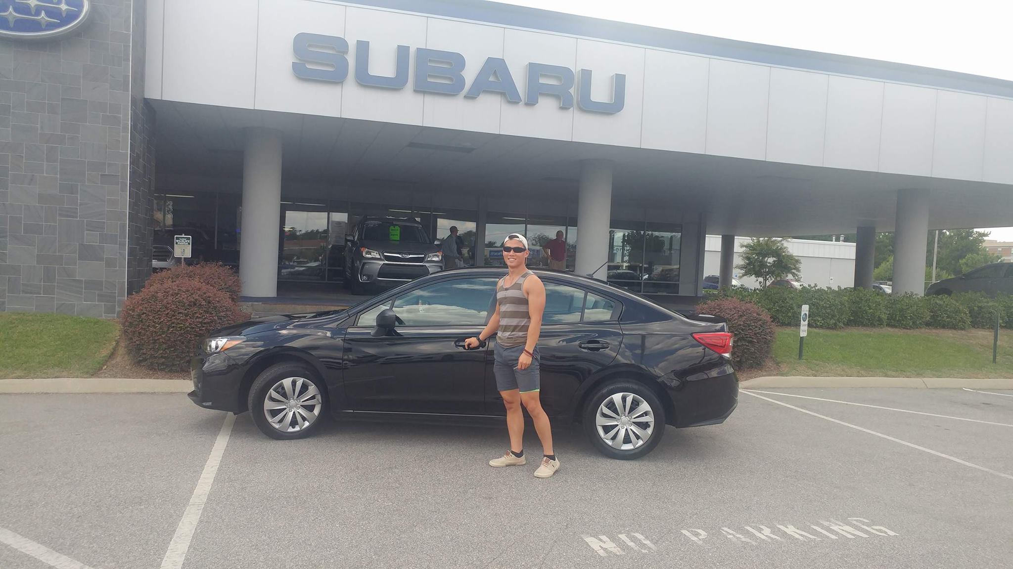 Steven with his new 2017 Impreza.jpg