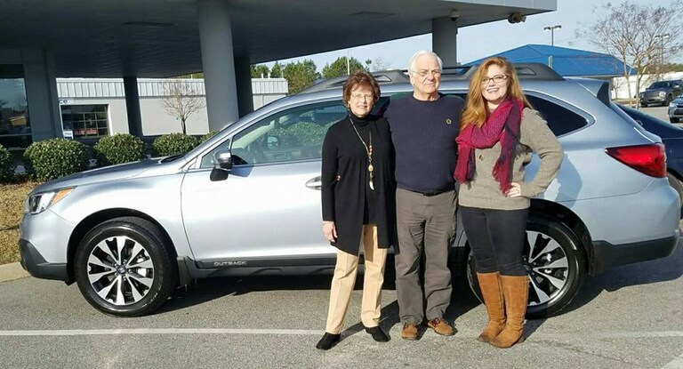 John & Linda Semmes with their new 2017 Outback (pictured with Sr Sales Advisor Emily Bracey).jpg