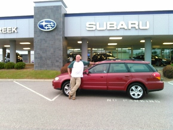 Mr & Mrs Johnson with their 2005 Outback.jpg