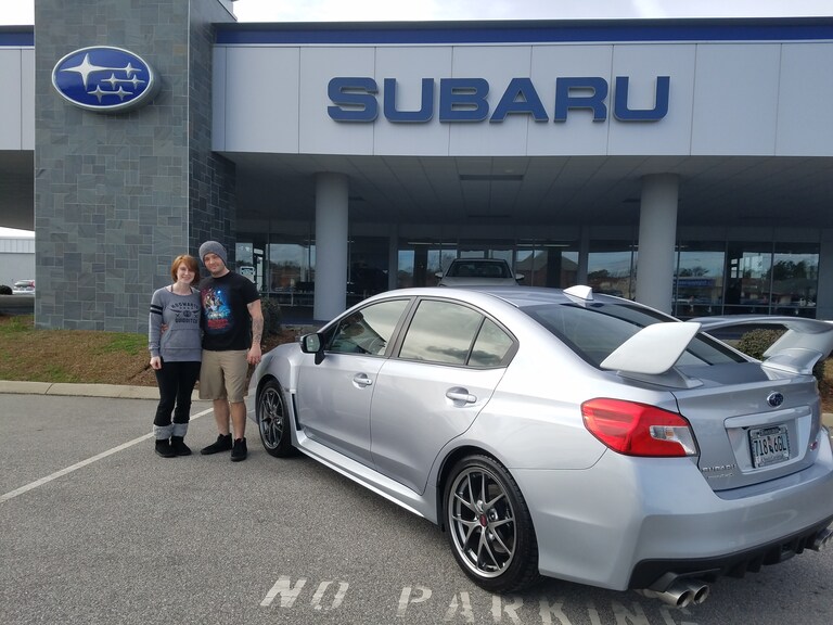 Michael with his girlfriend and his brand new 2016 WRX STI.jpg