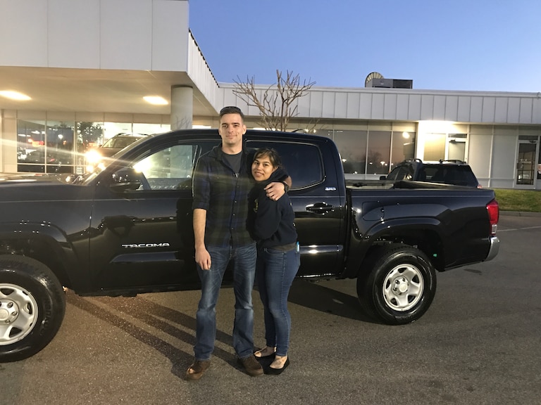 Andrew and his wife in front of his 2016 Tacoma pruchased from the #CrossCreekPreowned section.JPG