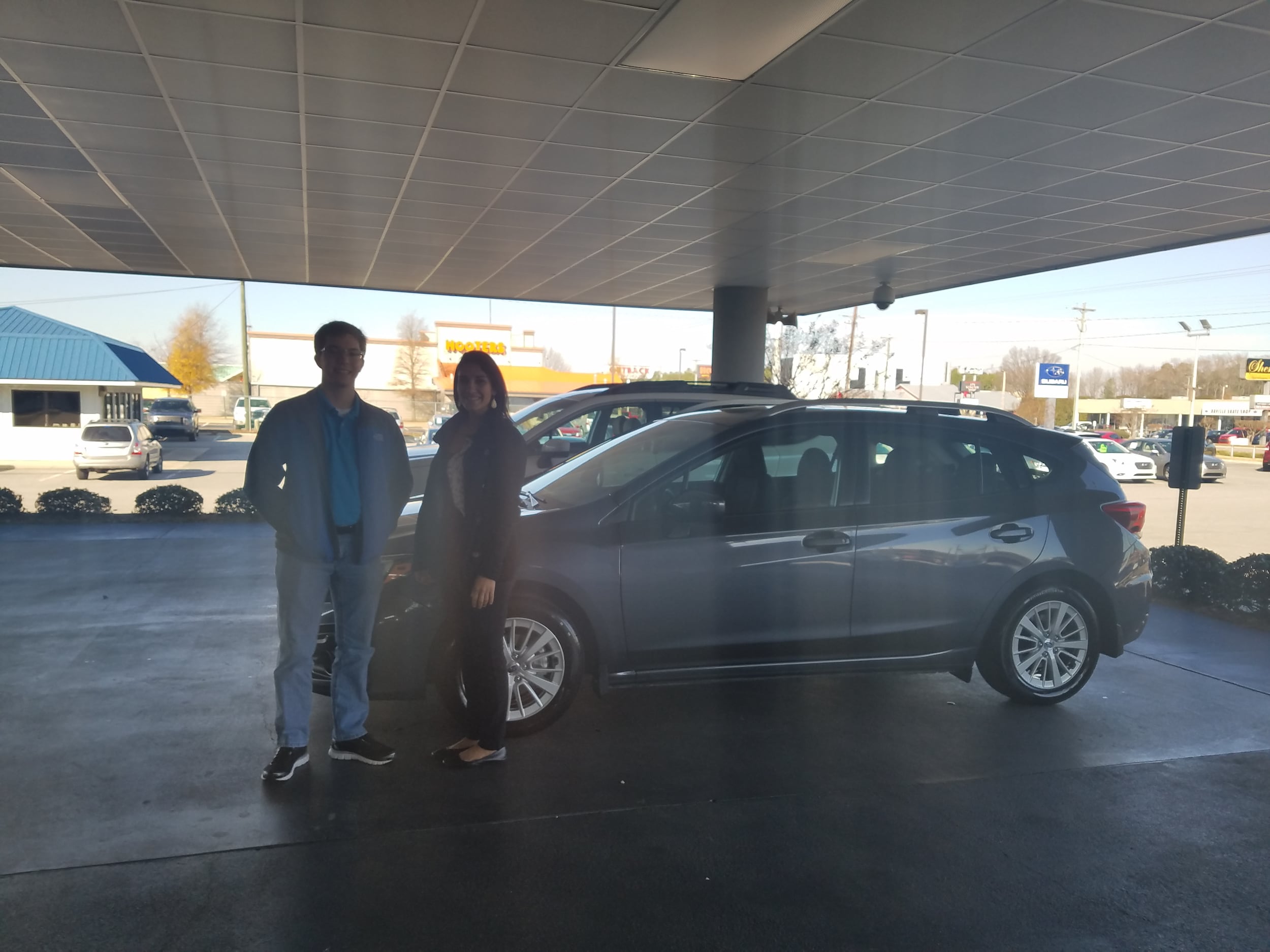 Jacob Regensburger with his 2017 Impreza and Sales Advisor Leidy!.jpg