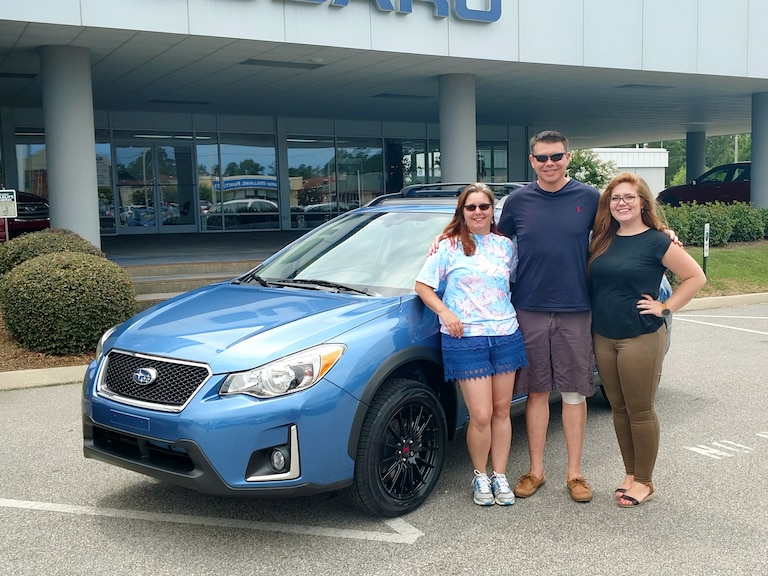 Mike & Laura with their first Subaru - a 2017 Crosstrek. Pictured with Sr Sales Advisor Emily!.jpg