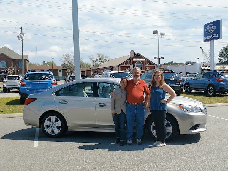 Mr & Mrs Wadford with Sr Sales Advisor Emily in front of their 2017 Legacy.jpg