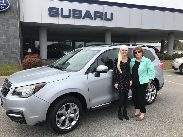 Cynthia Burnham & Sales Advisor Ava in front of Cynthia's new 2017 Forester.JPG