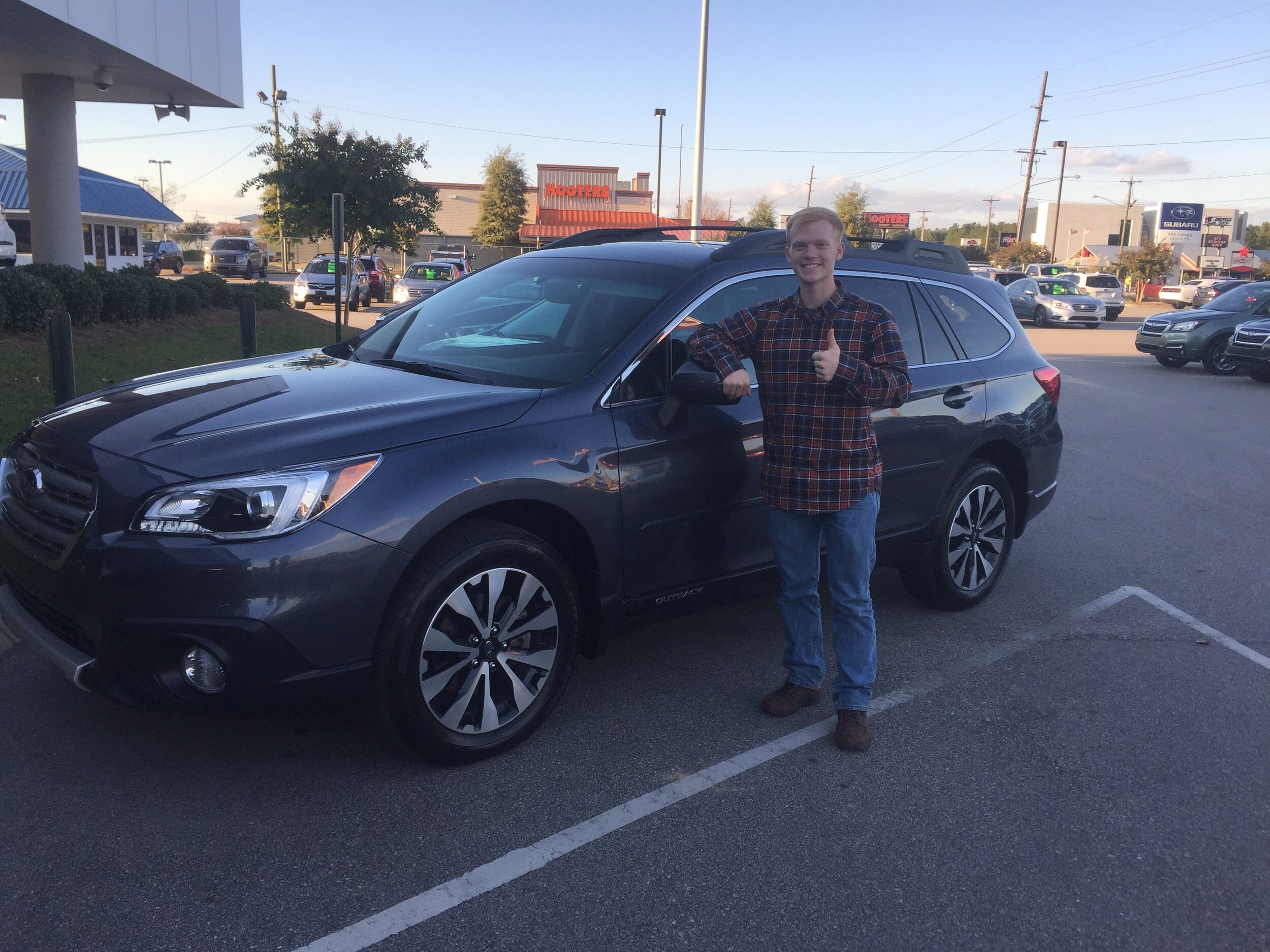 College student & Ski Instructor - Riley with his 2015 Outback, excited to go on his first adventure!.JPG