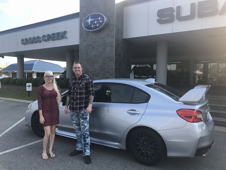 Boomer with Sales Advisor Ava in front of his brand new 2017 WRX STI.jpg