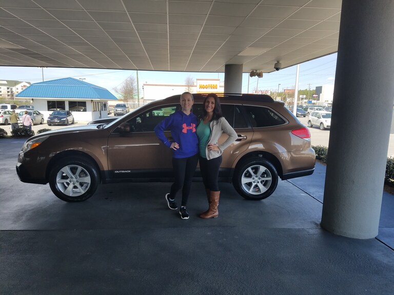 Jackie Brockman with Sales Advisor Leidy in front of her CPO 2013 Outback.jpg
