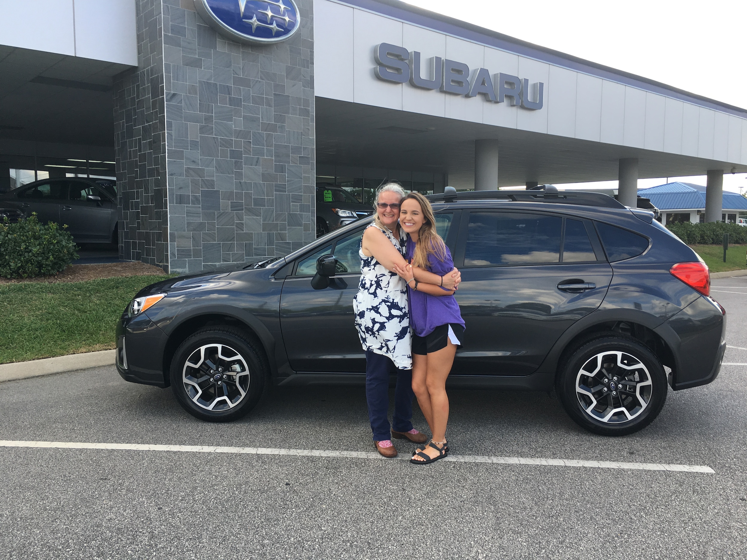 Lynn with daughter, Christie, in front of their first Subaru- a 2017 Crosstrek.JPG