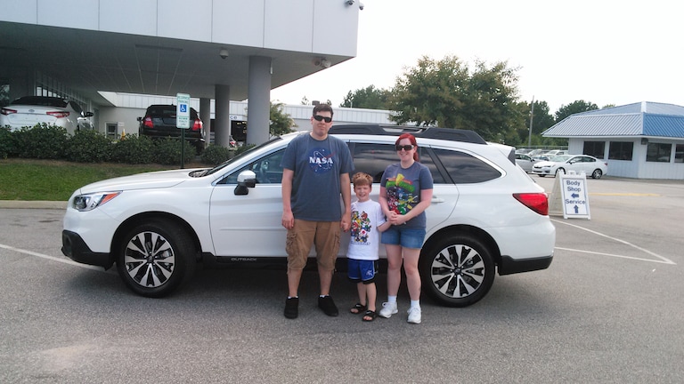 The Karn's in front of their new 2017 Outback.jpg