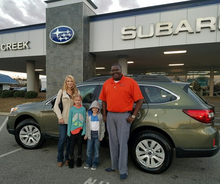 Mrs Koch and children in front of their new 2017 Outback (with Sr Sales Advisor Guy Jordan).jpg