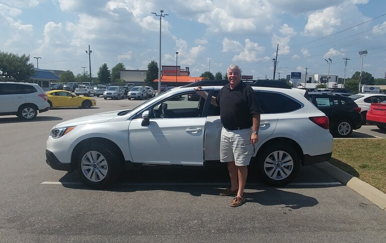 David in front of his first Subaru - a 2017 Outback.jpg