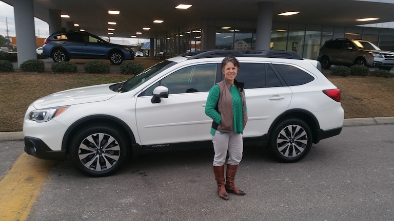 Mrs. Goepfert with her first Subaru - a 2015 Outback!.jpg