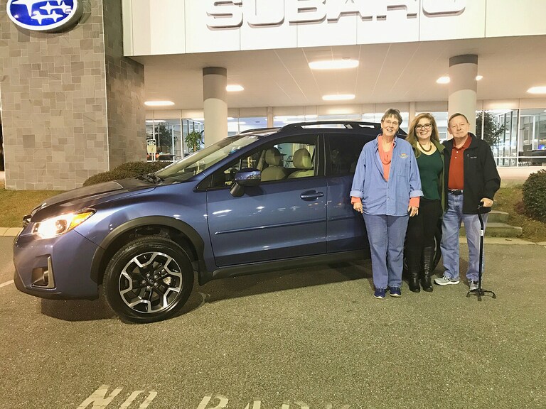 Georganna and Art Simpson with Sr Sales Advisor Emily Bracey and their new 2017 Outback.jpg