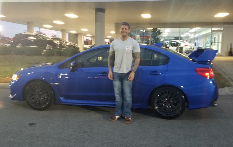 Michael Canaski with his 4th Subaru - the 2017 WRX STI.jpg