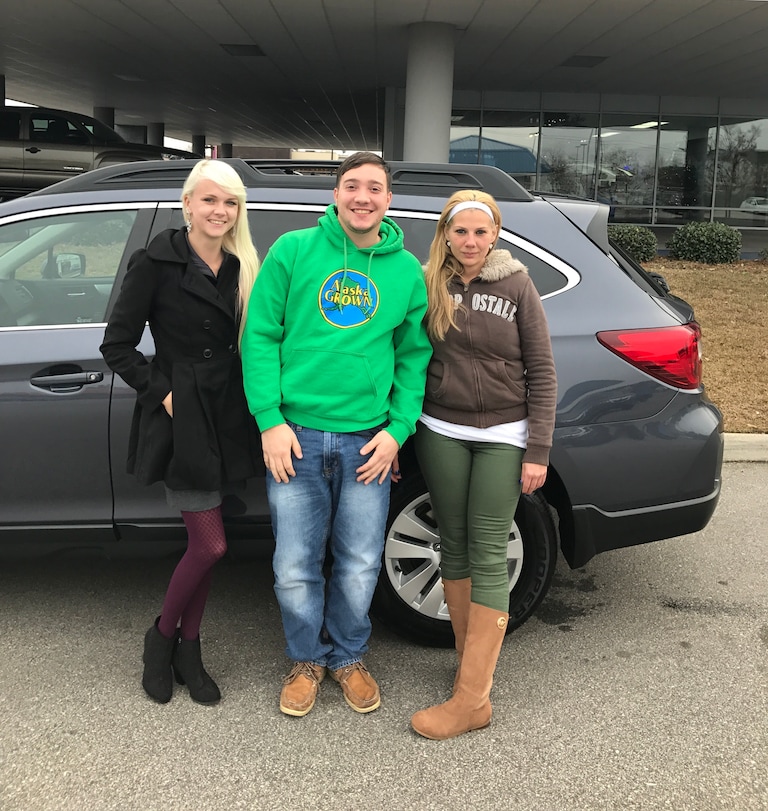 Ryan Harrison with Sales Advisors Ava Kunkel and Katey Meeks who helped him purchase his 2015 Outback.JPG